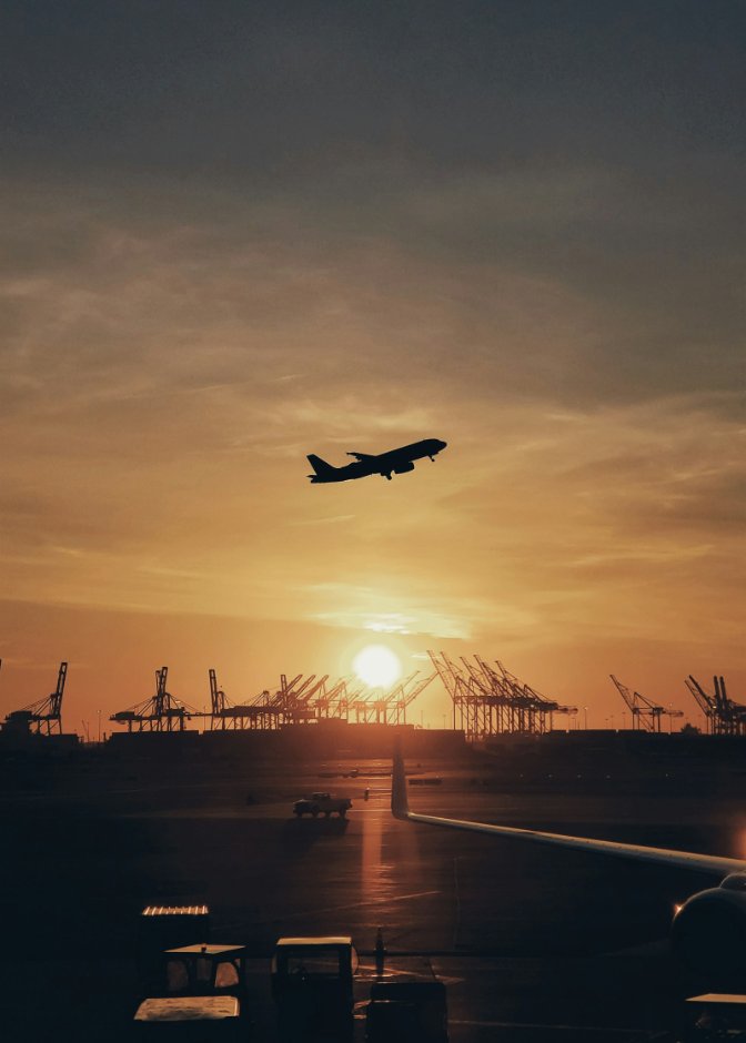 Aircraft taking off at sunset, representing Midway Airport service